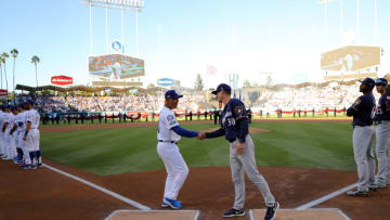 LOS ANGELES, CA - OCTOBER 15: Mangers Dave Robers #30 of the Los Angeles Dodgers and Craig Consell #30 of the Milwaukee Brewers shake hands before Game 3 of the NLCS at Dodger Stadium on Monday, October 15, 2018 in Los Angeles, California. (Photo by Alex Trautwig/MLB Photos via Getty Images)