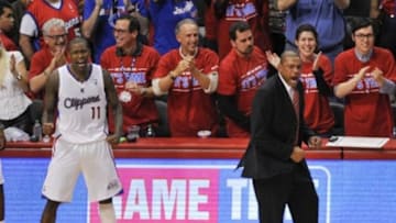 May 3, 2014; Los Angeles, CA, USA; Los Angeles Clippers head coach Doc Rivers and guard Jamal Crawford (11) celebrate during the fourth quarter against the Golden State Warriors in game seven of the first round of the 2014 NBA Playoffs at Staples Center. The Los Angeles Clippers defeated the Golden State Warriors 126-121. Mandatory Credit: Kelvin Kuo-USA TODAY Sports