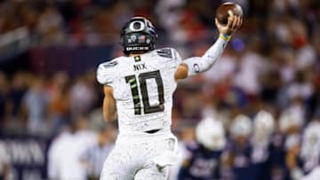 Former Auburn football quarterback Bo Nix was put in college football's top tier with Caleb Williams, Drake Maye, and Michael Penix Jr. per Marc Trestman Mandatory Credit: Mark J. Rebilas-USA TODAY Sports
