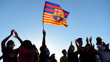 FC Barcelona fans gather outside the Camp Nou stadium in Barcelona on August 26, 2020 after Barcelona's Argentinian forward Lionel Messi announced his desire to leave the club. - Lionel Messi's bombshell request to leave Barcelona is expected to spark a legal battle over a multi-million-dollar buy-out clause but also raises the question of which club could afford him in the heat of the coronavirus pandemic. (Photo by Pau BARRENA / AFP) (Photo by PAU BARRENA/AFP via Getty Images)