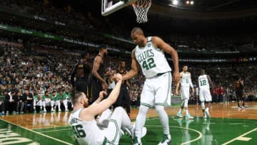 BOSTON, MA - MAY 27: Al Horford #42 helps Aron Baynes #46 of the Boston Celtics from the floor during Game Seven of the Eastern Conference Finals of the 2018 NBA Playoffs between the Cleveland Cavaliers and Boston Celtics on May 27, 2018 at the TD Garden in Boston, Massachusetts. NOTE TO USER: User expressly acknowledges and agrees that, by downloading and or using this photograph, User is consenting to the terms and conditions of the Getty Images License Agreement. Mandatory Copyright Notice: Copyright 2018 NBAE (Photo by Brian Babineau/NBAE via Getty Images)