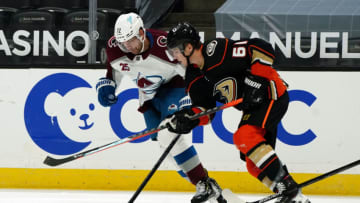 Jan 22, 2021; Anaheim, California, USA; Colorado Avalanche right wing Joonas Donskoi (72) and Anaheim Ducks center Troy Terry (61) battle for the puck in the third period at Honda Center. The Avalanche defeated the Ducks 3-2 in overtime. Mandatory Credit: Kirby Lee-USA TODAY Sports