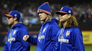 Nov 1, 2015; New York City, NY, USA; New York Mets pitchers including Noah Syndergaard (middle) and Jacob deGrom (right) walk to the dugout before game five of the World Series against the Kansas City Royals at Citi Field. Mandatory Credit: Robert Deutsch-USA TODAY Sports