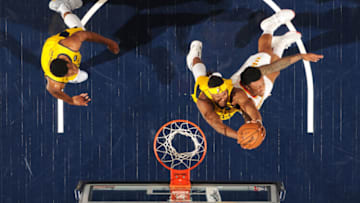 INDIANAPOLIS, IN - DECEMBER 31: Myles Turner #33 of the Indiana Pacers reaches for control of the ball against John Collins #20 of the Atlanta Hawks on December 31, 2018 at Bankers Life Fieldhouse in Indianapolis, Indiana. (Photo by Ron Hoskins/NBAE via Getty Images)