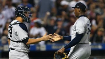 NEW YORK, NY - JUNE 09: Catcher Gary Sanchez #24 and closer Aroldis Chapman #54 of the New York Yankees shake hands after defeating the New York Mets 4-3 in a game at Citi Field on June 9, 2018 in the Flushing neighborhood of the Queens borough of New York City. (Photo by Rich Schultz/Getty Images)
