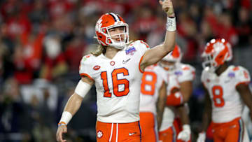 GLENDALE, ARIZONA - DECEMBER 28: Trevor Lawrence #16 of the Clemson Tigers celebrates his 34-yard touchdown pass to Travis Etienne (not pictured) against the Ohio State Buckeyes in the second half during the College Football Playoff Semifinal at the PlayStation Fiesta Bowl at State Farm Stadium on December 28, 2019 in Glendale, Arizona. (Photo by Matthew Stockman/Getty Images)