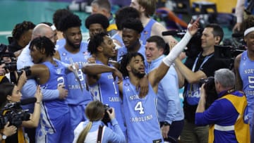 NEW ORLEANS, LOUISIANA - APRIL 02: Leaky Black #1 and R.J. Davis #4 of the North Carolina Tar Heels celebrate after defeating the Duke Blue Devils 81-77 in the second half of the game during the 2022 NCAA Men's Basketball Tournament Final Four semifinal at Caesars Superdome on April 02, 2022 in New Orleans, Louisiana. (Photo by Chris Graythen/Getty Images)