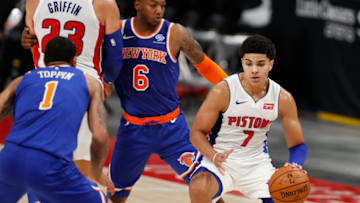Detroit Pistons guard Killian Hayes (7) dribbles the ball between New York Knicks guard Elfrid Payton (6) and forward Obi Toppin (1) Credit: Raj Mehta-USA TODAY Sports