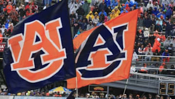Dec 30, 2015; Birmingham, AL, USA; Auburn Tigers cheerleaders fly their flags high after scoring in the 2015 Birmingham Bowl against the Memphis Tigers at Legion Field. Mandatory Credit: Marvin Gentry-USA TODAY Sports