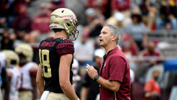Apr 10, 2021; Tallahassee, Florida, USA; Florida State Seminoles head coach Mike Norvell speaks with quarterback Tate Rodemaker (18) during the annual Garnet and Gold Spring Game held at Doak Campbell Stadium. Mandatory Credit: Melina Myers-USA TODAY Sports