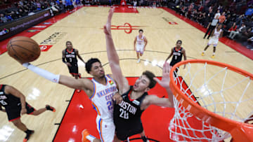 Aaron Wiggins #21 of the Oklahoma City Thunder dunks the ball over Alperen Sengun #28 of the Houston Rockets during the second half at Toyota Center on November 29, 2021 in Houston, Texas. NOTE TO USER: User expressly acknowledges and agrees that, by downloading and or using this photograph, User is consenting to the terms and conditions of the Getty Images License Agreement. (Photo by Carmen Mandato/Getty Images)