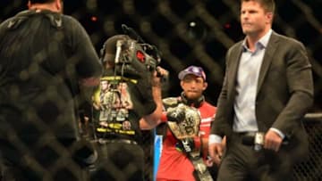 Aug 3, 2013; Rio De Janeiro, Brazil; Jose Aldo (red gloves) celebrates after defeating Chan Sung Jung during UFC 163 at HSBC Arena. Mandatory Credit: Jason Silva-USA TODAY Sports