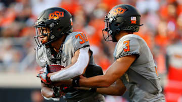 Chuba Hubbard, Spencer Sanders, Oklahoma State Cowboys. (Photo by Brian Bahr/Getty Images)