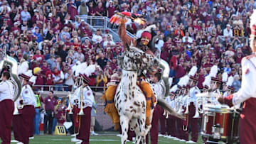 Nov 29, 2014; Tallahassee, FL, USA; Florida State Seminoles mascot Chief Osceola rides Renaeade on to the field prior to the game against the Florida Gators at Doak Campbell Stadium. Florida State Seminoles defeated Florida Gators 24-19. Mandatory Credit: Tommy Gilligan-USA TODAY Sports