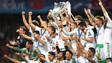 KIEV, UKRAINE - MAY 26: Sergio Ramos of Real Madrid lifts The UEFA Champions League trophy as his teammates celebrate following their sides victory in the UEFA Champions League Final between Real Madrid and Liverpool at NSC Olimpiyskiy Stadium on May 26, 2018 in Kiev, Ukraine. (Photo by Michael Regan/Getty Images)