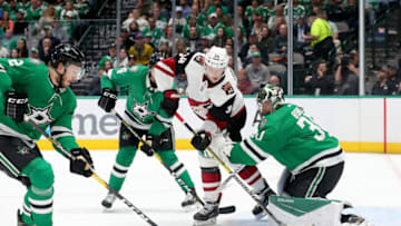 DALLAS, TEXAS - FEBRUARY 19: Carl Soderberg #34 of the Arizona Coyotes controls the puck against Ben Bishop #30 of the Dallas Stars and Miro Heiskanen #4 of the Dallas Stars in the second period at American Airlines Center on February 19, 2020 in Dallas, Texas. (Photo by Tom Pennington/Getty Images)