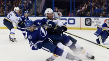 Feb 14, 2016; Tampa, FL, USA; St. Louis Blues defenseman Joel Edmundson (6) defends Tampa Bay Lightning center Steven Stamkos (91) during the second period at Amalie Arena. Mandatory Credit: Kim Klement-USA TODAY Sports