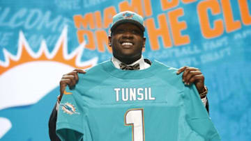 Apr 28, 2016; Chicago, IL, USA; Laremy Tunsil (Mississippi) is selected by the Miami Dolphins as the number thirteen overall pick in the first round of the 2016 NFL Draft at Auditorium Theatre. Mandatory Credit: Kamil Krzaczynski-USA TODAY Sports
