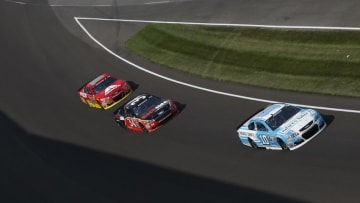 Jul 24, 2016; Indianapolis, IN, USA; NASCAR Sprint Cup driver Danica Patrick (10) drives into turn one followed by Chris Buescher (34) and Jeff Gordon (88) during the Combat Wounded Coalition 400 at the Brickyard at the Indianapolis Motor Speedway. Mandatory Credit: Brian Spurlock-USA TODAY Sports