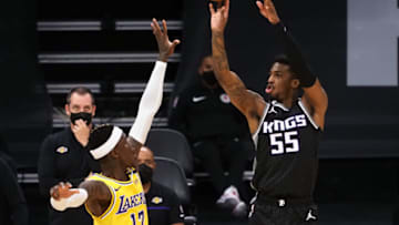 Apr 2, 2021; Sacramento, California, USA; Sacramento Kings guard Delon Wright (55) shoots the ball above Los Angeles Lakers guard Dennis Schroder (17) during the third quarter at Golden 1 Center. Mandatory Credit: Kelley L Cox-USA TODAY Sports