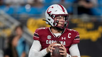Sep 2, 2023; Charlotte, North Carolina, USA; South Carolina Gamecocks quarterback Spencer Rattler (7) looks for a receiver during the second half against the North Carolina Tar Heels at Bank of America Stadium. Mandatory Credit: Jim Dedmon-USA TODAY Sports