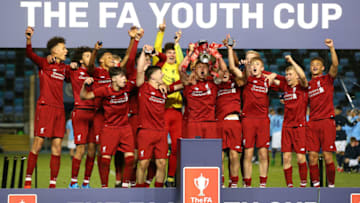 MANCHESTER, ENGLAND - APRIL 25: Paul Glatzel the captain of Liverpool lifts the FA Youth Trophy after victory in the FA Youth Cup Final between Manchester City and Liverpool at Manchester City Football Academy on April 25, 2019 in Manchester, England. (Photo by Alex Livesey/Getty Images)