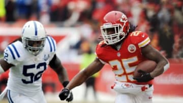 Dec 22, 2013; Kansas City, MO, USA; Kansas City Chiefs running back Jamaal Charles (25) runs the ball as Indianapolis Colts inside linebacker Kelvin Sheppard (52) attempts the tackle during the first half at Arrowhead Stadium. Mandatory Credit: Denny Medley-USA TODAY Sports