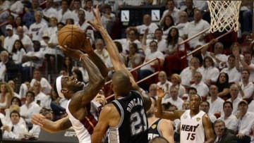 Jun 6, 2013; Miami, FL, USA; Miami Heat small forward LeBron James (6) shoots against San Antonio Spurs power forward Tim Duncan (21) during the second quarter of game one of the 2013 NBA Finals at the American Airlines Arena. Mandatory Credit: Steve Mitchell-USA TODAY Sports