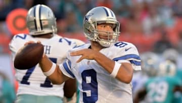 Aug 23, 2014; Miami Gardens, FL, USA; Dallas Cowboys quarterback Tony Romo (9) throws a pass against the Miami Dolphins defense during the first half at Sun Life Stadium. Mandatory Credit: Steve Mitchell-USA TODAY Sports