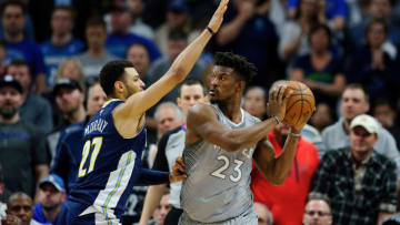 MINNEAPOLIS, MN - APRIL 11: Jamal Murray #27 of the Denver Nuggets defends against Jimmy Butler #23 of the Minnesota Timberwolves. (Photo by Hannah Foslien/Getty Images)