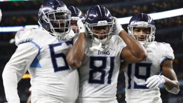 ARLINGTON, TX - NOVEMBER 05: Quinton Spain #67 and Tajae Sharpe #19 of the Tennessee Titans celebrate the touchdown by Jonnu Smith #81 in the third quarter of a football game against the Dallas Cowboys at AT&T Stadium on November 5, 2018 in Arlington, Texas. (Photo by Ronald Martinez/Getty Images)