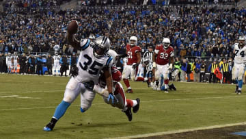 Jan 24, 2016; Charlotte, NC, USA; Carolina Panthers fullback Mike Tolbert (35) scores a two point conservation fourth quarter against Arizona Cardinals linebacker Sean Weatherspoon (55) in the NFC Championship football game at Bank of America Stadium. Mandatory Credit: Bob Donnan-USA TODAY Sports