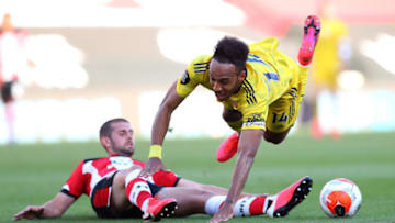 SOUTHAMPTON, ENGLAND - JUNE 25: Jack Stephens of Southampton fouls Pierre-Emerick Aubameyang of Arsenal leading to a red card during the Premier League match between Southampton FC and Arsenal FC at St Mary's Stadium on June 25, 2020 in Southampton, United Kingdom. (Photo by Catherine Ivill/Getty Images)