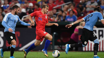 USA's Paxton Pomykal (C) is flanked by Uruguay's Nahitan Nandez (L) and Martin Caceres (R) during the International Friendly football match between the United States and Uruguay at Busch Stadium, in St. Louis Missouri on September 10, 2019. (Photo by Tim Vizer / AFP) (Photo credit should read TIM VIZER/AFP/Getty Images)