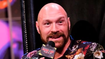 Tyson Fury speaks during a press conference with Deontay Wilder. (Photo by RINGO CHIU/AFP via Getty Images)