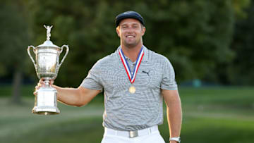 MAMARONECK, NEW YORK - SEPTEMBER 20: Bryson DeChambeau of the United States celebrates with the championship trophy after winning the 120th U.S. Open Championship on September 20, 2020 at Winged Foot Golf Club in Mamaroneck, New York. (Photo by Gregory Shamus/Getty Images)