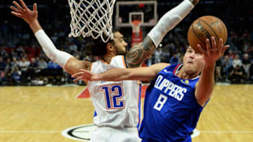 LOS ANGELES, CA - OCTOBER 19: Danilo Gallinari #8 of the Los Angeles Clippers scores a basket against Steven Adams #12 of the Oklahoma City Thunder during the second half of a basketball game at Staples Center on October 19, 2018 in Los Angeles, California. NOTE TO USER: User expressly acknowledges and agrees that, by downloading and or using this photograph, User is consenting to the terms and conditions of the Getty Images License Agreement. (Photo by Kevork Djansezian/Getty Images)
