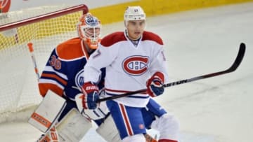 Oct 27, 2014; Edmonton, Alberta, CAN; Montreal Canadiens left wing Rene Bourque (17) screens Edmonton Oilers goalie Ben Scrivens (30) in the first period at Rexall Place. Mandatory Credit: Chris LaFrance-USA TODAY Sports