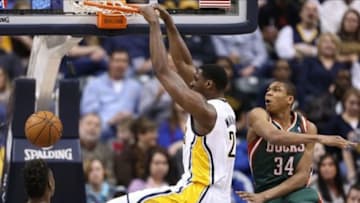 Feb 27, 2014; Indianapolis, IN, USA; Indiana Pacers center Ian Mahinmi (28) dunks the ball in front of Milwaukee Bucks forward Giannis Antetokounmpo (34) at Bankers Life Fieldhouse. Mandatory Credit: Brian Spurlock-USA TODAY Sports