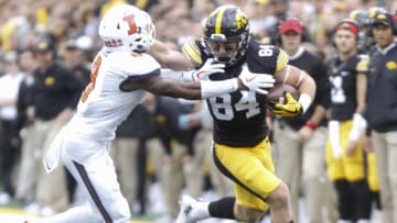 IOWA CITY, IOWA- OCTOBER 07: Wide receiver Nick Easley #84 of the Iowa Hawkeyes rushes up field during the first quarter past defensive back Nate Hobbs #8 of the Illinois Fighting Illini on October 7, 2017 at Kinnick Stadium in Iowa City, Iowa. (Photo by Matthew Holst/Getty Images)