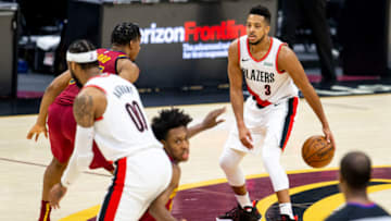 CLEVELAND, OH - MAY 5: CJ McCollum #3 of the Portland Trail Blazers looks for a route to the basket at Rocket Mortgage Fieldhouse on May 5, 2021 in Cleveland, Ohio. The Portland Trail Blazers beat the Cleveland Cavaliers 141-105. NOTE TO USER: User expressly acknowledges and agrees that, by downloading and or using this photograph, User is consenting to the terms and conditions of the Getty Images License Agreement. (Photo by Lauren Bacho/Getty Images)