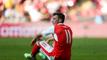 LONDON, ENGLAND - APRIL 23: Mesut Ozil of Arsenal sits on the pitch during the Emirates FA Cup semi-final match between Arsenal and Manchester City at Wembley Stadium on April 23, 2017 in London, England. (Photo by Catherine Ivill - AMA/Getty Images)