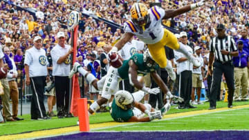 LSU wide receiver Ja’Marr Chase catches a 9-yard touchdown pass from quarterback Joe Burrow to give Tigers a 7-0 lead over Southeastern Louisiana in the first quarter Saturday night at Tiger Stadium.Lsu SoutheasternLSU wide receiver JaaTMMarr Chase catches a 9-yard touchdown pass from quarterback Joe Burrow to give Tigers a 7-0 lead over Southeastern Louisiana in the first quarter Saturday night at Tiger Stadium.