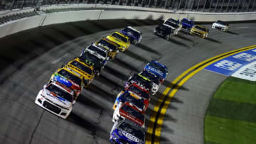 DAYTONA BEACH, FLORIDA - FEBRUARY 13: Alex Bowman, driver of the #88 Valvoline Chevrolet, and Kevin Harvick, driver of the #4 Busch Light #PIT4BUSCH Ford, lead the field during the NASCAR Cup Series Bluegreen Vacations Duel 2 at Daytona International Speedway on February 13, 2020 in Daytona Beach, Florida. (Photo by Jared C. Tilton/Getty Images)
