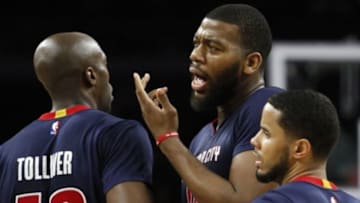 Feb 8, 2015; Auburn Hills, MI, USA; Detroit Pistons forward Greg Monroe (10) questions referee Ed Malloy (not pictured) after getting a technical foul during the second quarter against the Minnesota Timberwolves at The Palace of Auburn Hills. Detroit Pistons forward Anthony Tolliver (43) holds him back. Mandatory Credit: Raj Mehta-USA TODAY Sports
