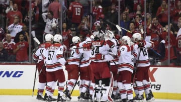 WASHINGTON, DC - APRIL 24: Brock McGinn #23 of the Carolina Hurricanes celebrates with his teammates after scoring the game winning goal in the second overtime period against the Washington Capitals in Game Seven of the Eastern Conference First Round during the 2019 NHL Stanley Cup Playoffs at Capital One Arena on April 24, 2019 in Washington, DC. The Hurricanes defeated the Capitals 4-3 in the second overtime period to move on to Round Two of the Stanley Cup playoffs. (Photo by Patrick McDermott/NHLI via Getty Images)