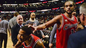 Dec 16, 2015; Chicago, IL, USA; Chicago Bulls guard Derrick Rose (1) and Chicago Bulls center Joakim Noah (13) react after beating the Memphis Grizzlies 98-85 at the United Center. Mandatory Credit: Matt Marton-USA TODAY Sports
