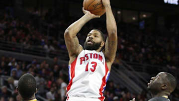 Jan 16, 2016; Auburn Hills, MI, USA; Detroit Pistons forward Marcus Morris (13) takes a shot over Golden State Warriors forward Harrison Barnes (40) and forward Draymond Green (23) during the second quarter at The Palace of Auburn Hills. The Pistons won 113-95. Mandatory Credit: Raj Mehta-USA TODAY Sports