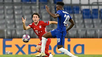 Bayern Munich's Spanish defender Alvaro Odriozola (L) fights for the ball with Chelsea's English midfielder Callum Hudson-Odoi during the UEFA Champions League, second-leg round of 16, football match FC Bayern Munich v FC Chelsea in Munich, southern Germany on August 8, 2020. (Photo by Tobias SCHWARZ / AFP) (Photo by TOBIAS SCHWARZ/AFP via Getty Images)