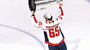 LAS VEGAS, NV - JUNE 07: Andre Burakovsky #65 of the Washington Capitals hoists the Stanley Cup after his team defeated the Vegas Golden Knights 4-3 in Game Five of the 2018 NHL Stanley Cup Final at T-Mobile Arena on June 7, 2018 in Las Vegas, Nevada. (Photo by Ethan Miller/Getty Images)